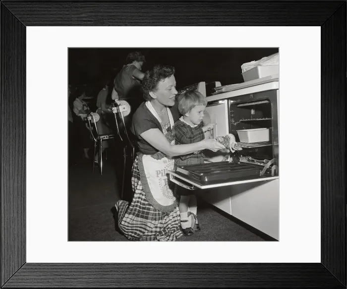 Framed Print : Pillsbury Finalist with Young Daughter Looking in Oven Framed Print : Pillsbury Finalist with Young Daughter Looking in Oven