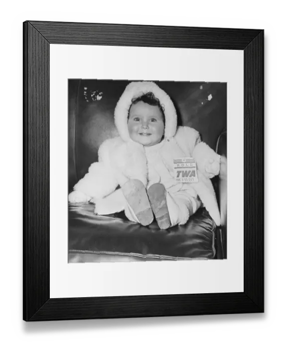 Framed Print : Baby Waiting for Her Parents to Clear Customs Framed Print : Baby Waiting for Her Parents to Clear Customs