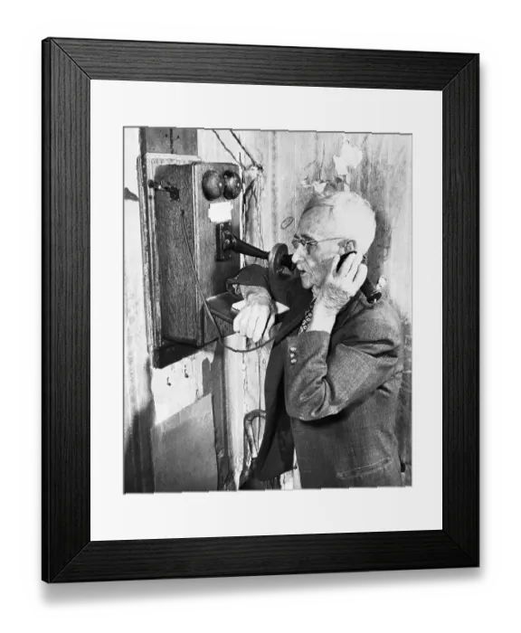 Framed Print : Man Talks on Old-Style Telephone Framed Print : Man Talks on Old-Style Telephone