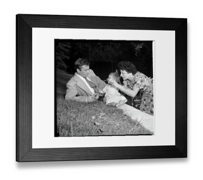 Framed Print : James Mason With Wife and Daughter in the Garden of Their Home Framed Print : James Mason With Wife and Daughter in the Garden of Their Home