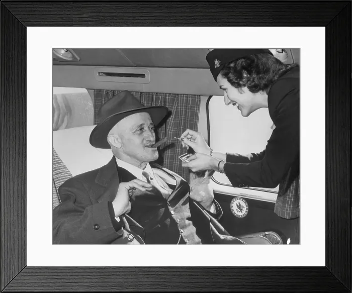 Framed Print : Flight Attendant Lighting Cigar for Passenger Framed Print : Flight Attendant Lighting Cigar for Passenger