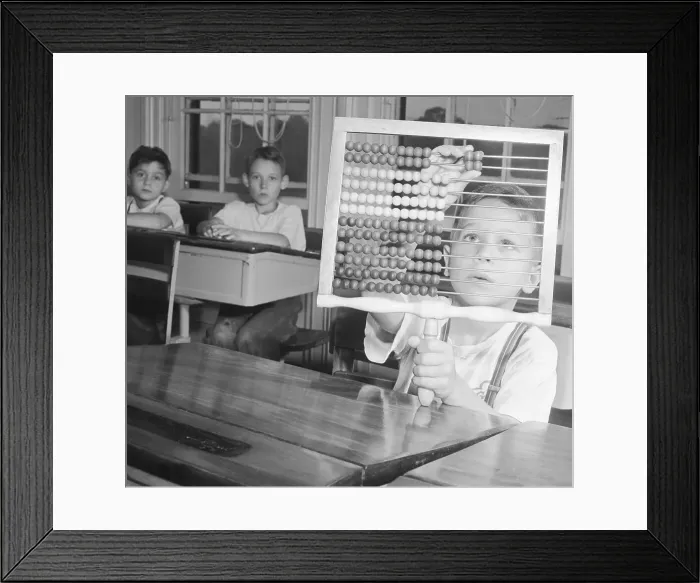 Framed Print : Boy Using Abacus in Class Framed Print : Boy Using Abacus in Class