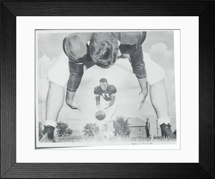 Framed Print : Football Player Passing Ball to Teammate Framed Print : Football Player Passing Ball to Teammate