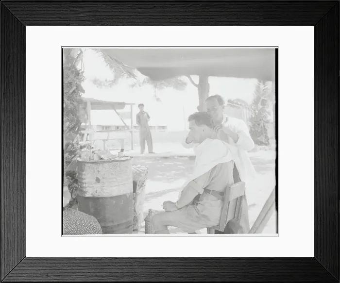 Framed Print : Man Getting Haircut at Encampment Framed Print : Man Getting Haircut at Encampment