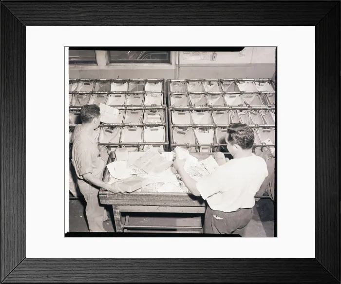 Framed Print : Workers Sort Letters into Airmail Bags Framed Print : Workers Sort Letters into Airmail Bags