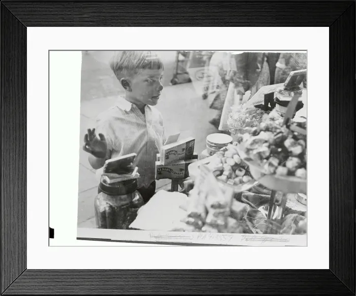 Framed Print : Little Boy Looking Into a Candy Shop Framed Print : Little Boy Looking Into a Candy Shop