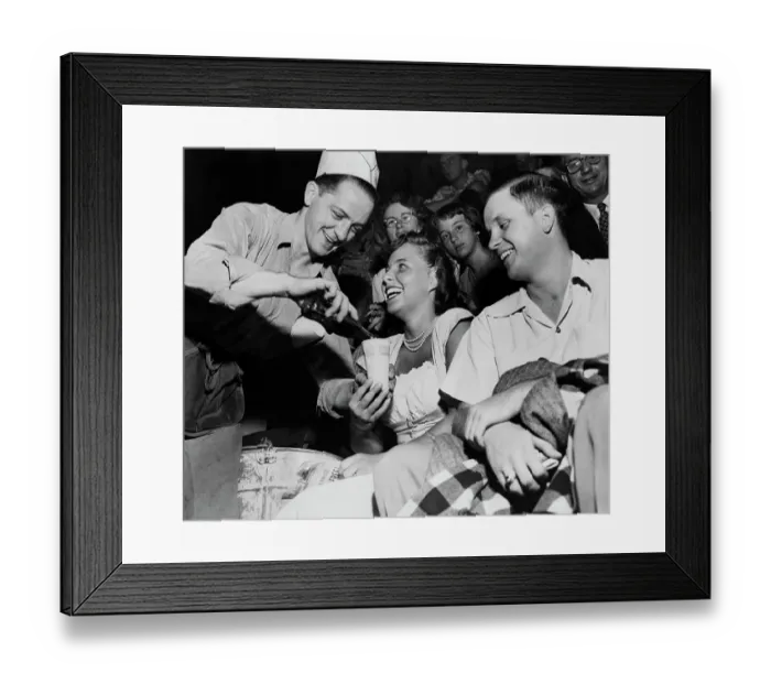 Framed Print : Vendor Pouring Soda for Couple at Baseball Game