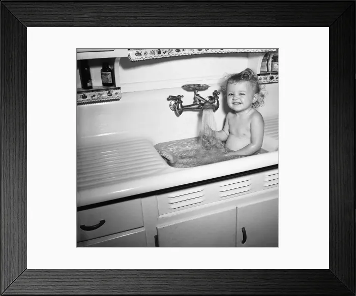 Framed Print : Little Girl Taking Bath in Kichen Sink Framed Print : Little Girl Taking Bath in Kichen Sink