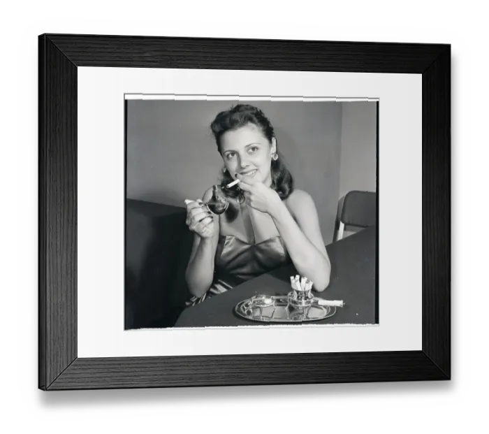 Framed Print : Woman Uses Jeweled Cigarette Lighter Framed Print : Woman Uses Jeweled Cigarette Lighter