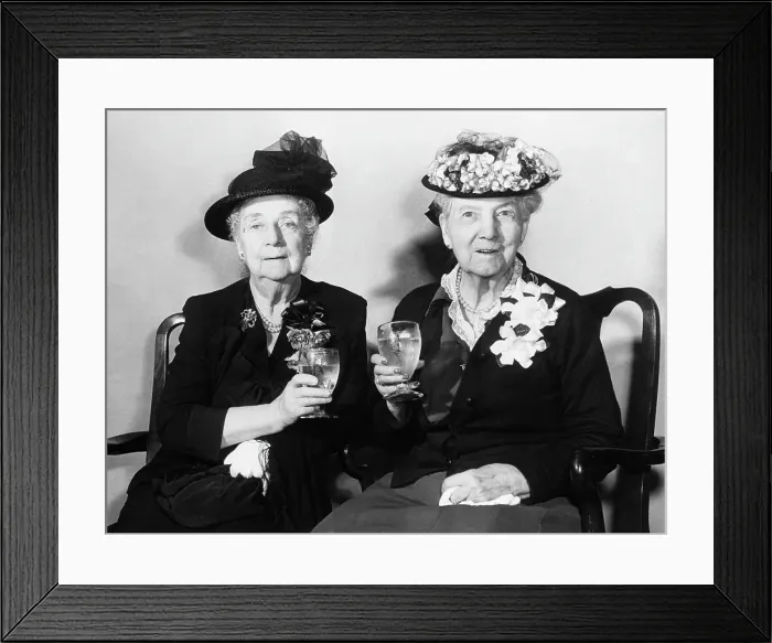 Framed Print : Elederly Women Holding Drinking Glasses Framed Print : Elederly Women Holding Drinking Glasses