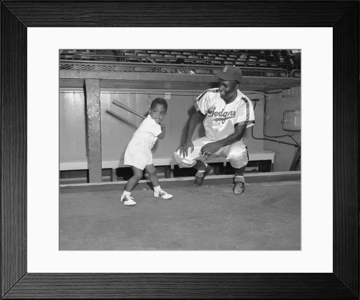 Framed Print : Jackie Robinson Watching His Son Swinging Bat Framed Print : Jackie Robinson Watching His Son Swinging Bat