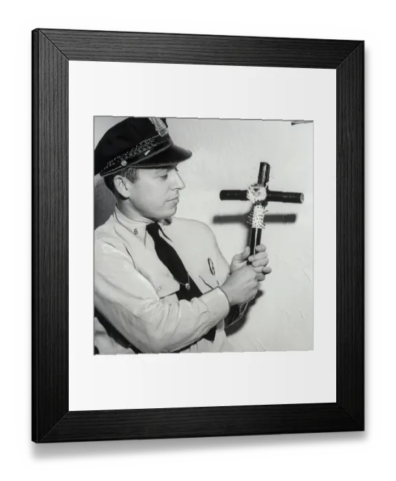 Framed Print : Police Officer Holding Voodoo Cross Framed Print : Police Officer Holding Voodoo Cross