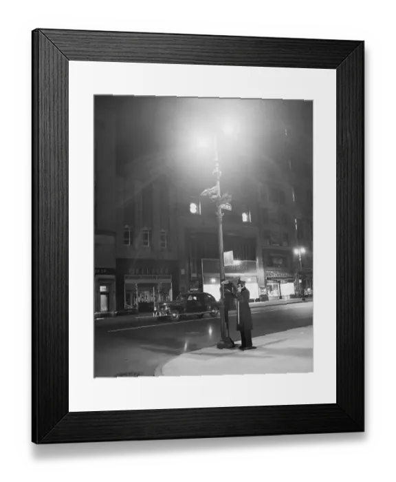 Framed Print : Officer Using Streetlamp Callbox