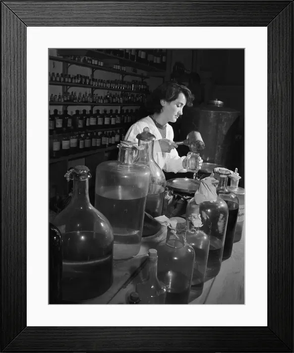 Framed Print : Woman Filling Small Bottles of Perfumes Framed Print : Woman Filling Small Bottles of Perfumes