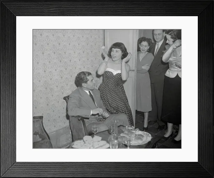 Framed Print : Woman Sitting on Arm of Lucky Luciano's Armchair Framed Print : Woman Sitting on Arm of Lucky Luciano's Armchair