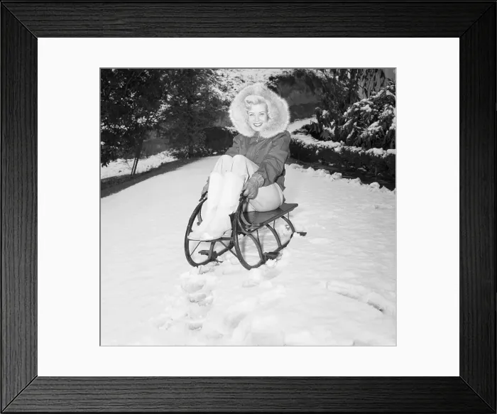 Framed Print : Actress Gloria DeHaven on Snow Sled Framed Print : Actress Gloria DeHaven on Snow Sled