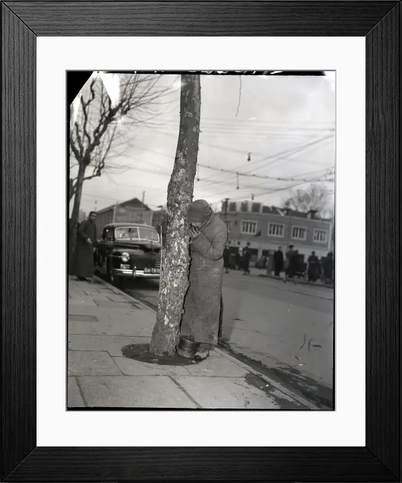 Framed Print : Hungrey Refugee Eating Bark
