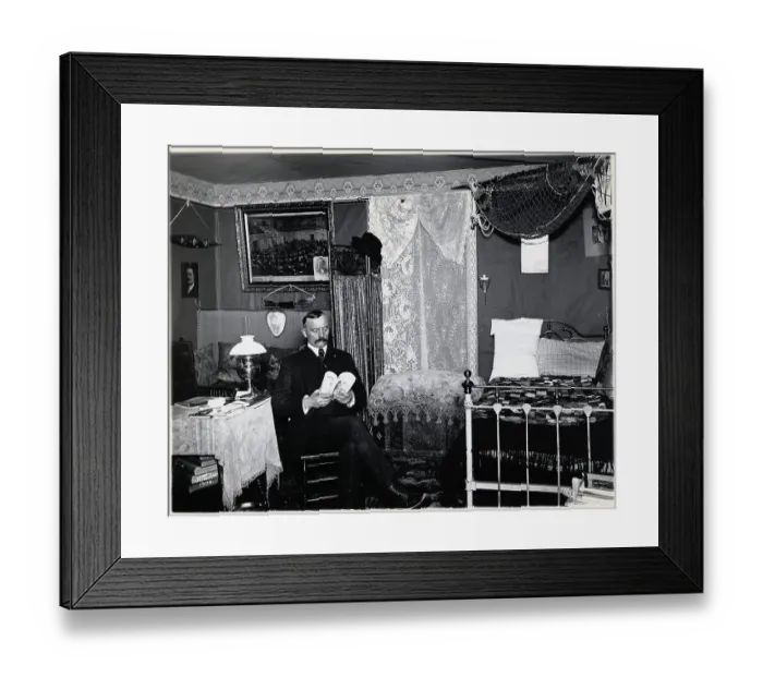 Framed Print : Man Seated in Bedroom Reading Framed Print : Man Seated in Bedroom Reading