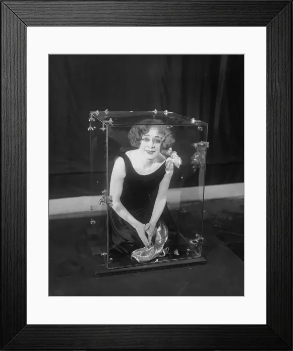 Framed Print : Beatrice Houdini Demonstrating an Illusion Framed Print : Beatrice Houdini Demonstrating an Illusion
