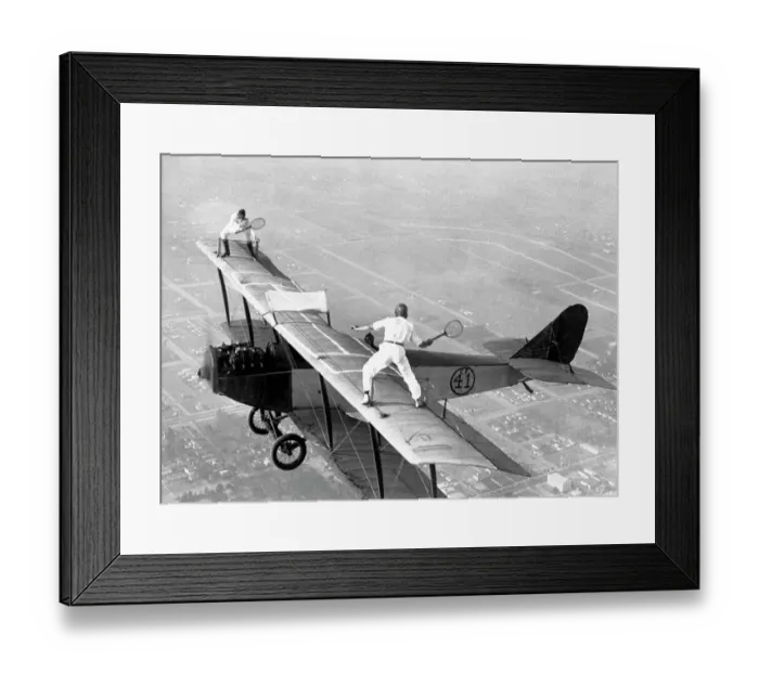 Framed Print : Daredevils Playing Tennis on a Biplane Framed Print : Daredevils Playing Tennis on a Biplane