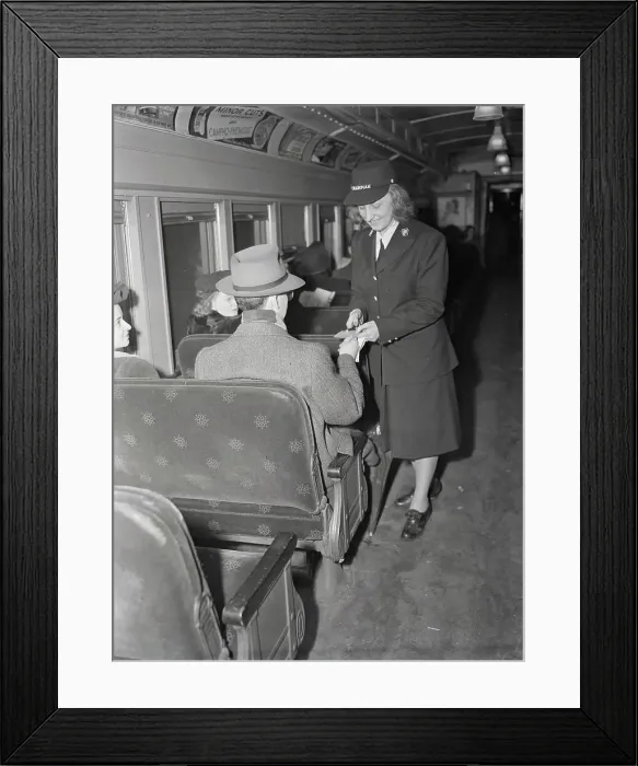 Framed Print : Female Conductor Taking Train Ticket from Passenger Framed Print : Female Conductor Taking Train Ticket from Passenger