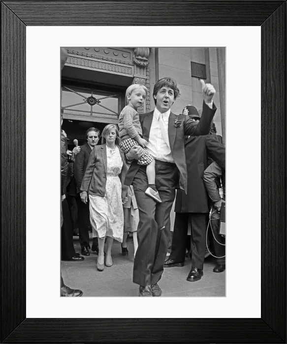 Framed Print : Paul McCartney Carrying Child Framed Print : Paul McCartney Carrying Child