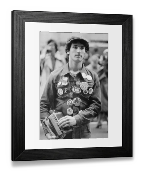 Framed Print : Youth with Beatles Buttons Carries Radio
