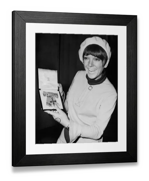 Framed Print : Mary Quant Holding Her O.B.E Framed Print : Mary Quant Holding Her O.B.E