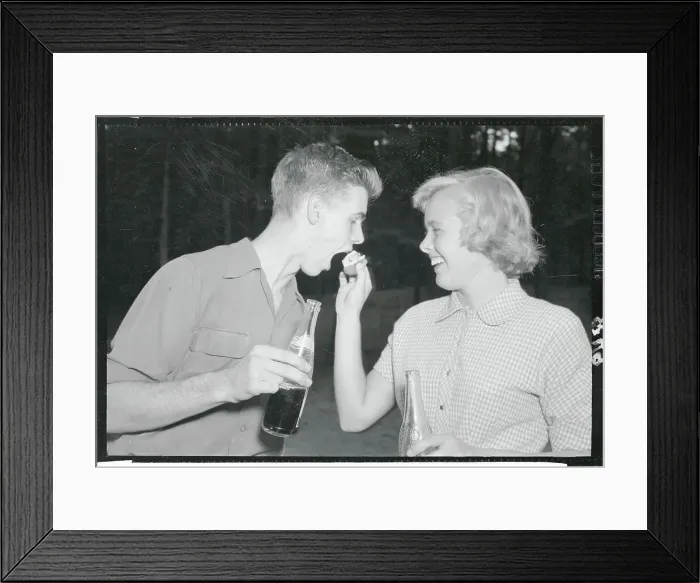 Framed Print : Teenagers Sharing a Hot Dog Framed Print : Teenagers Sharing a Hot Dog