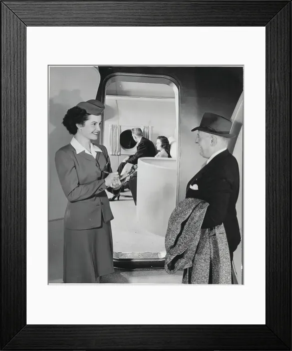 Framed Print : Stewardess Checking in Passenger on Boeing Stratocruiser Framed Print : Stewardess Checking in Passenger on Boeing Stratocruiser