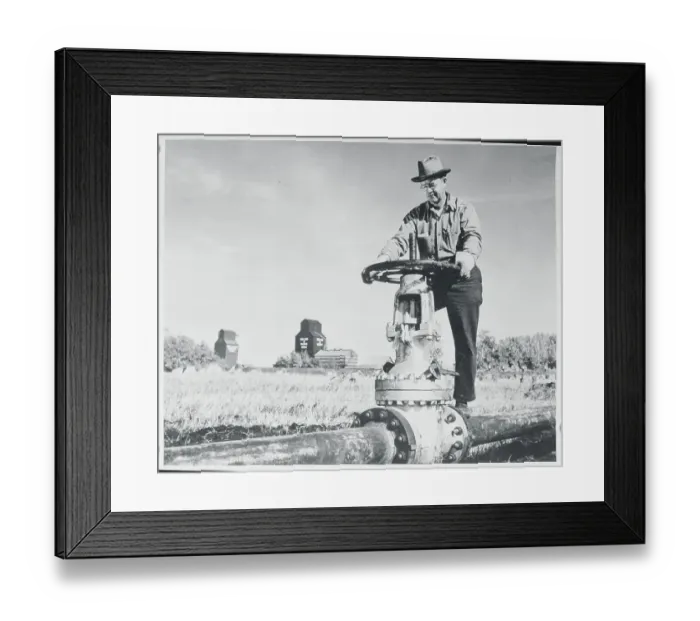 Framed Print : Man Opening Pipe Line Valve Framed Print : Man Opening Pipe Line Valve