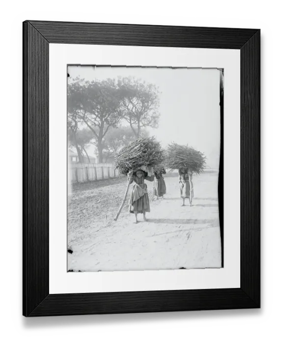 Framed Print : Early Workers Carrying Wood Scraps on Their Backs Framed Print : Early Workers Carrying Wood Scraps on Their Backs
