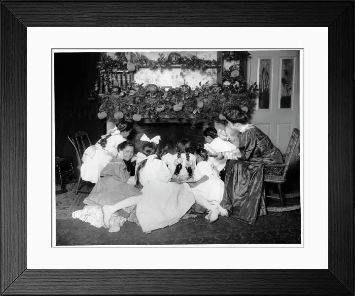 Framed Print : Girls Seated At A Fireplace On Halloween Framed Print : Girls Seated At A Fireplace On Halloween