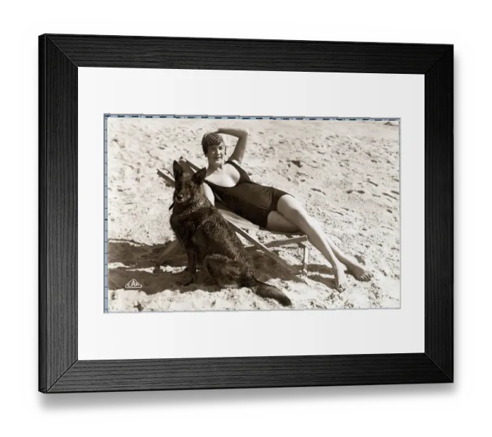 Framed Print : Sunbathing Woman On Beach With Dog Framed Print : Sunbathing Woman On Beach With Dog
