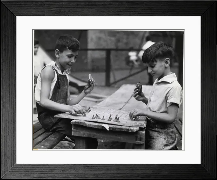 Framed Print : Boys Playing Game and Eating Cookies Framed Print : Boys Playing Game and Eating Cookies