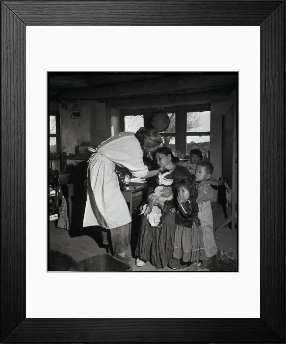 Framed Print : Nurse Treating Mother And Children Framed Print : Nurse Treating Mother And Children