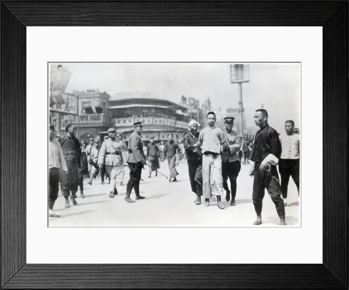 Framed Print : Chinese Rebel Being Led Away By Police Framed Print : Chinese Rebel Being Led Away By Police