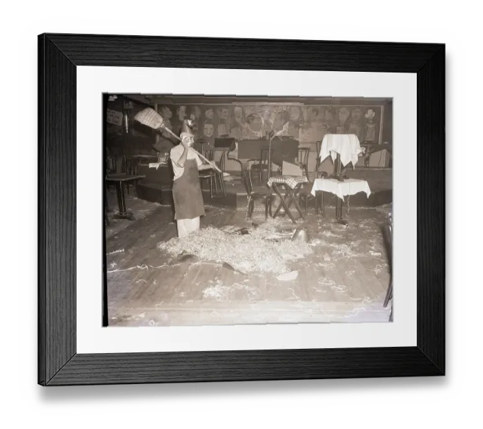 Framed Print : Man Cleaning Up After A New Years Party Framed Print : Man Cleaning Up After A New Years Party
