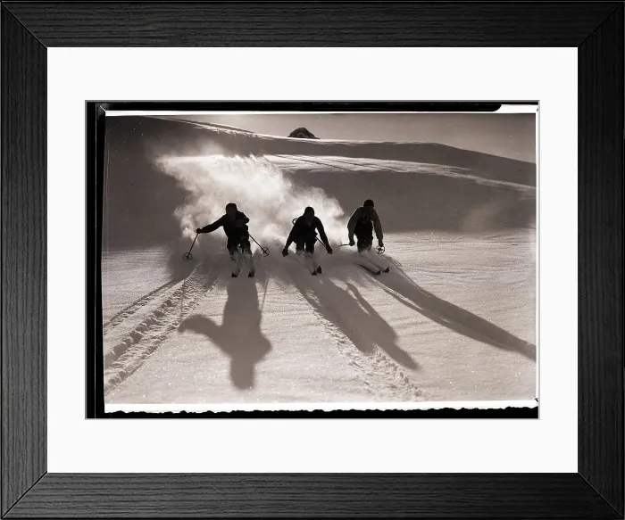 Framed Print : Three Silhouetted Skiers Descend Slope Framed Print : Three Silhouetted Skiers Descend Slope