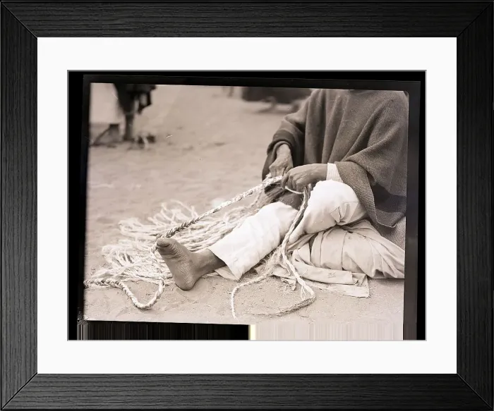 Framed Print : Man Twisting Rope with His Feet Framed Print : Man Twisting Rope with His Feet