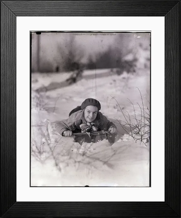 Framed Print : Girl Riding A Sled In The Snow Framed Print : Girl Riding A Sled In The Snow