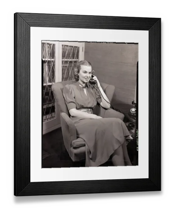 Framed Print : Seated Woman Talking in Telephone Framed Print : Seated Woman Talking in Telephone