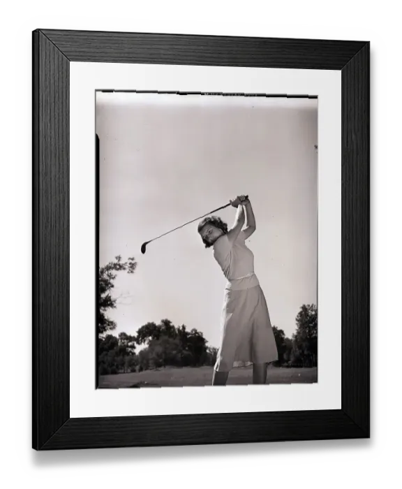 Framed Print : Woman Swinging Golf Club Framed Print : Woman Swinging Golf Club