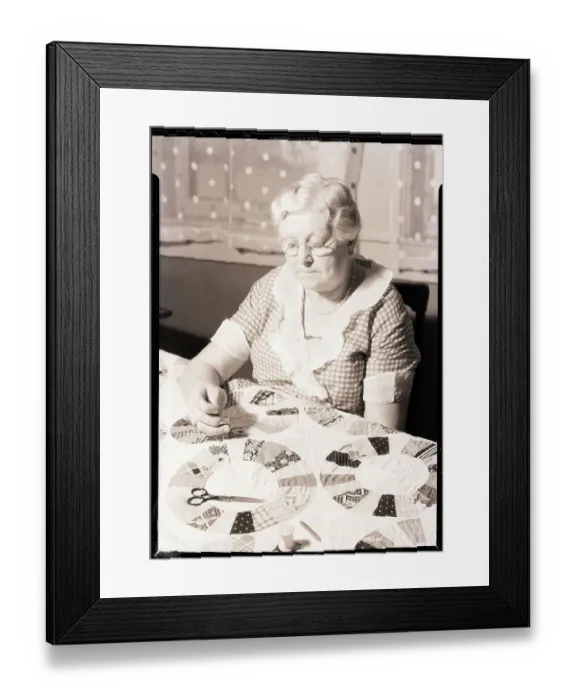 Framed Print : Elderly Woman Making Quilt Framed Print : Elderly Woman Making Quilt