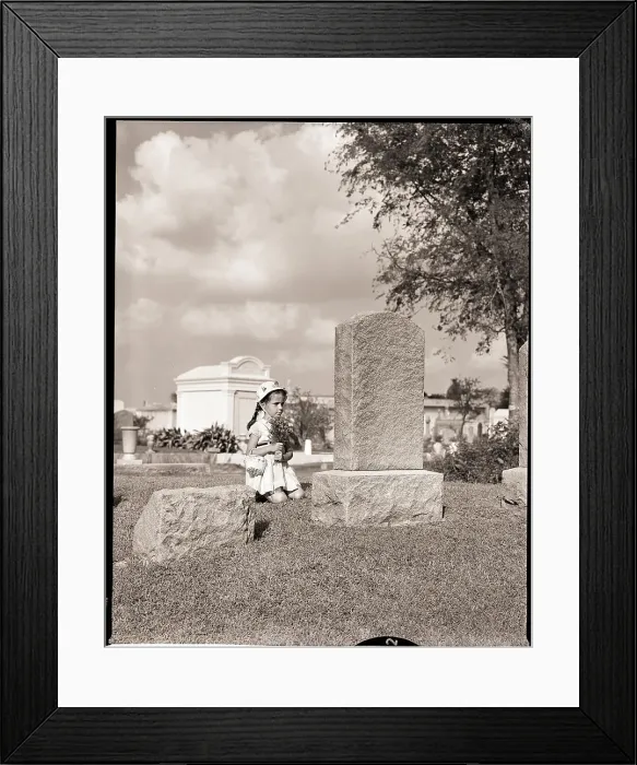 Framed Print : Girl Kneels at Headstone Framed Print : Girl Kneels at Headstone