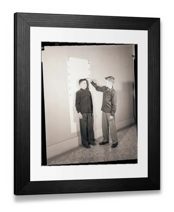 Framed Print : Boys Measuring Height Framed Print : Boys Measuring Height