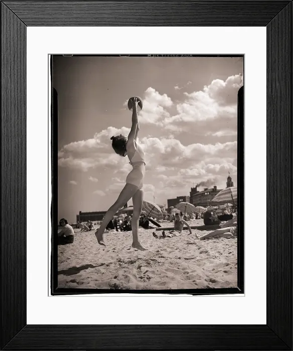 Framed Print : Young Woman Playing Ball On Beach Framed Print : Young Woman Playing Ball On Beach