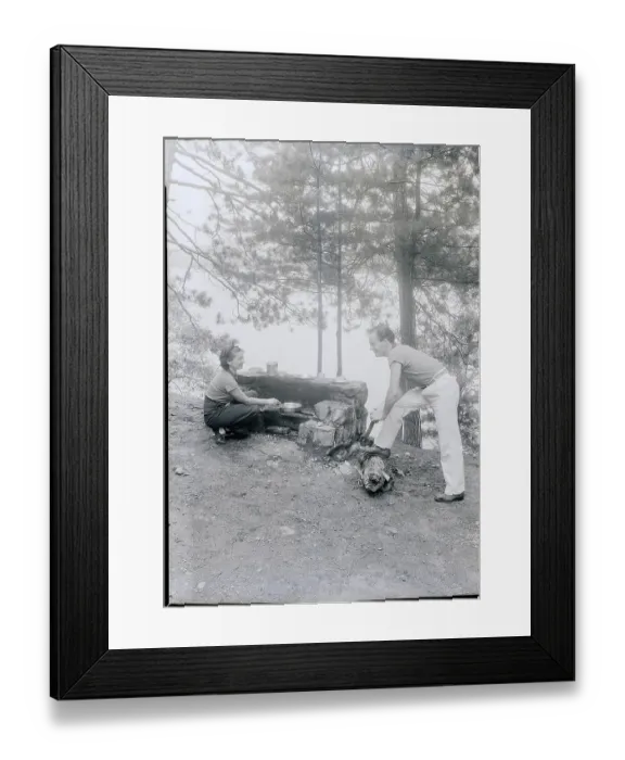 Framed Print : Couple Cooking While Camping Framed Print : Couple Cooking While Camping