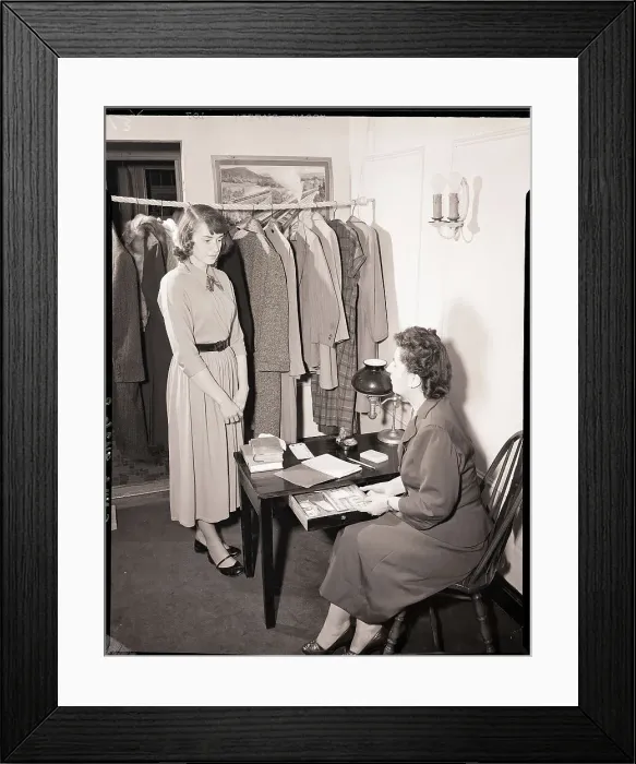Framed Print : A Young Woman Stands Before Seated Woman Framed Print : A Young Woman Stands Before Seated Woman
