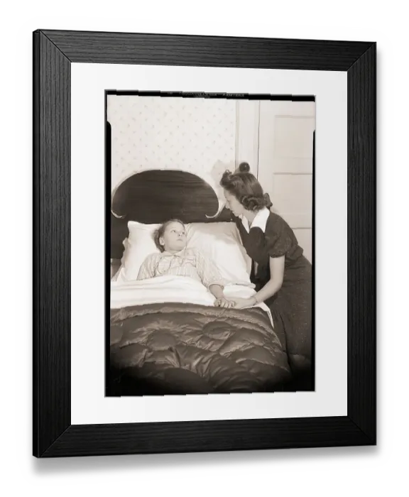 Framed Print : Mother Holding Child's Hand in Bed Framed Print : Mother Holding Child's Hand in Bed